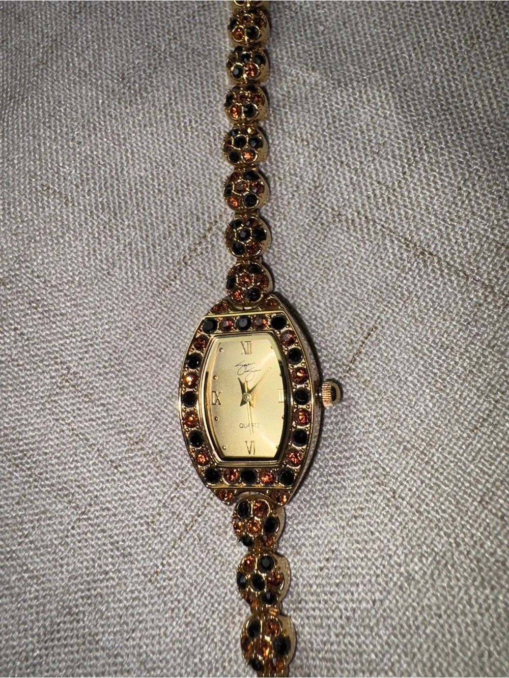 Gold-Tone Garnet Accent Womens Bracelet Watch